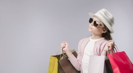 glamorous-girl-with-shopping-bags-studio